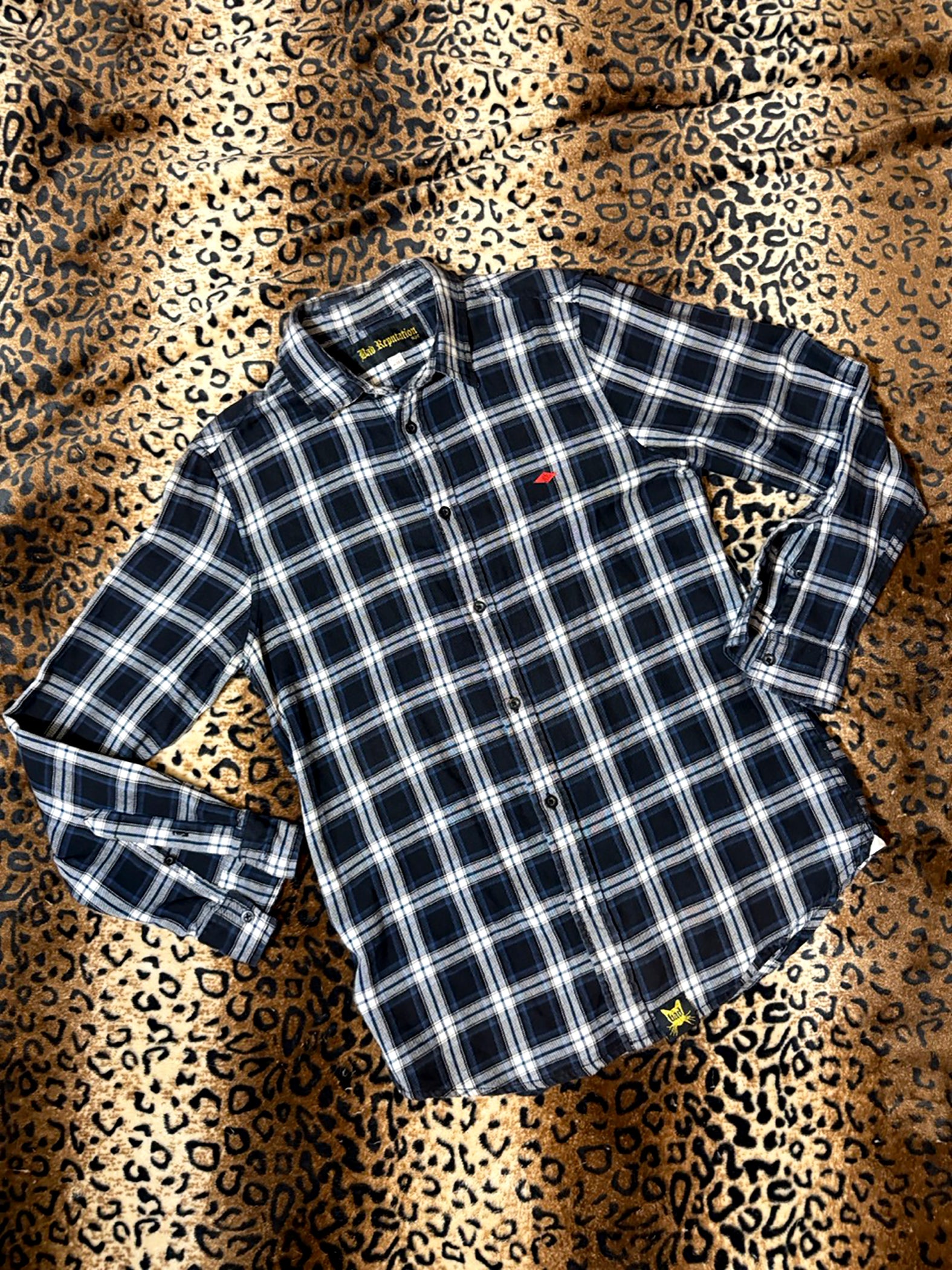 Plaid shirt on a leopard print background