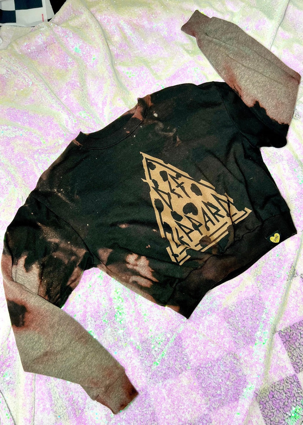 def leppard bleach dye sweatshirt on a sequin background