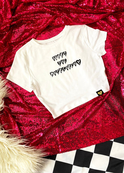 abort the patriarchy crop top on a hot pink sequin background