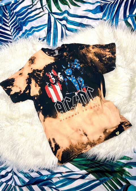 acdc band t shirt with american flag design on a white furry background 