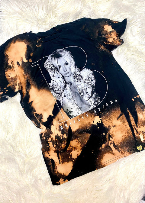 britney spears bleach dye t shirt on a white furry background