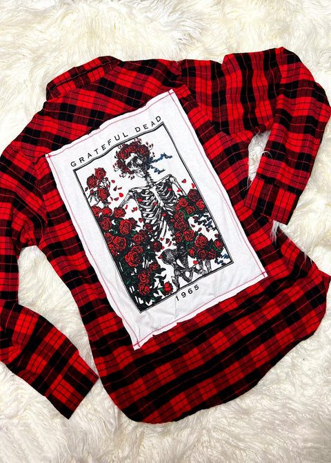 grateful dead red flannel on a white furry background