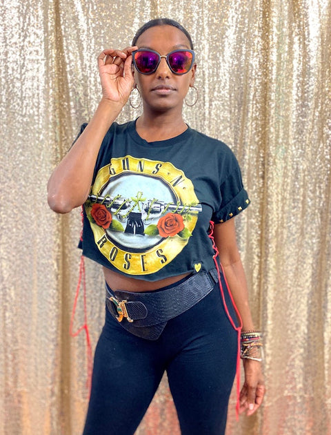 guns n roses black crop top on model with sunglasses in front of gold background