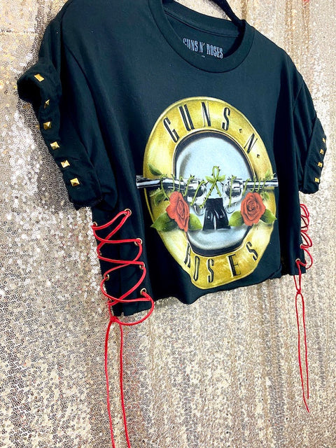 guns n roses black crop top side angle view in front of gold background