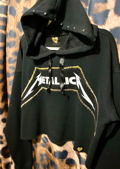 black metallica hoodie with studded hood on leopard print background