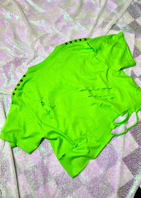 neon green distressed crop top on holographic sequin background back