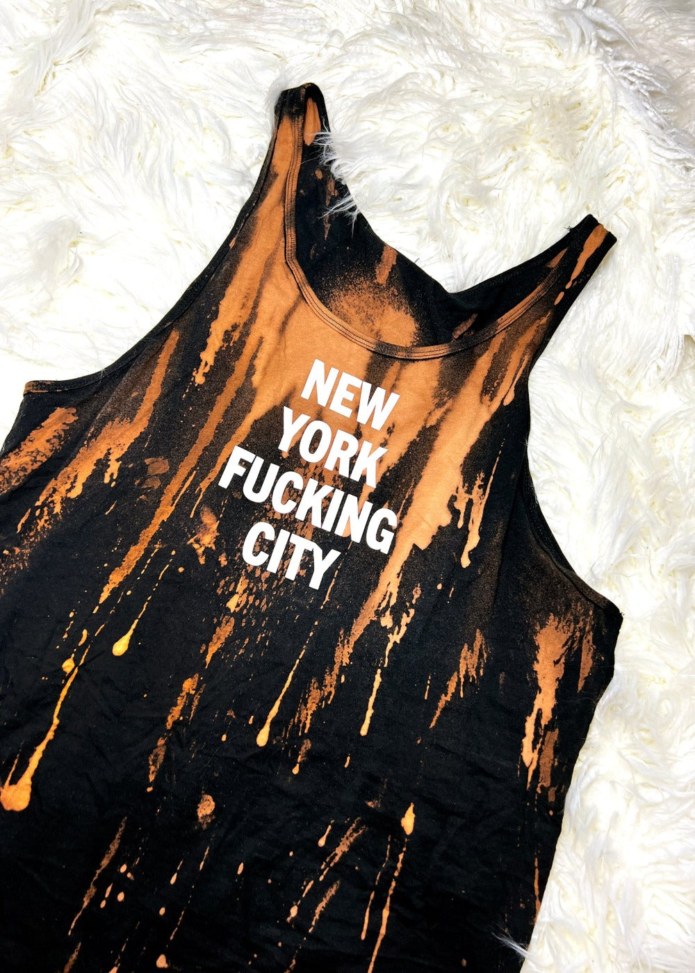 bleach dyed tank top on a white furry background alternate angle view