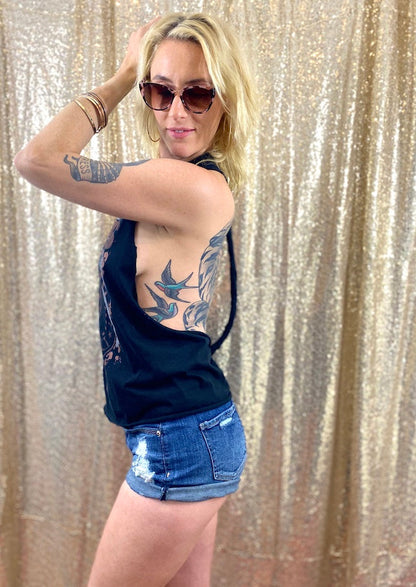 black ramones tank top on tattooed model in denim shorts side view