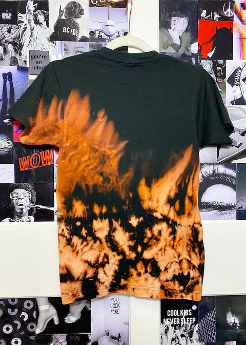 back of bleach dyed slayer t shirt on pop culture collage background