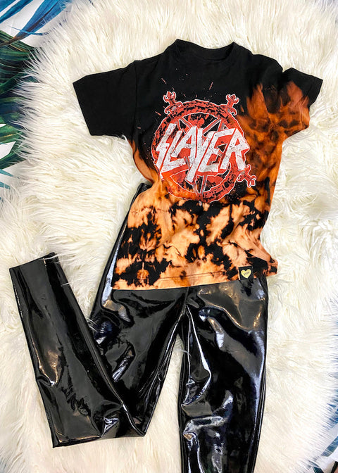 bleach dyed slayer t shirt with black vinyl pants on white furry rug