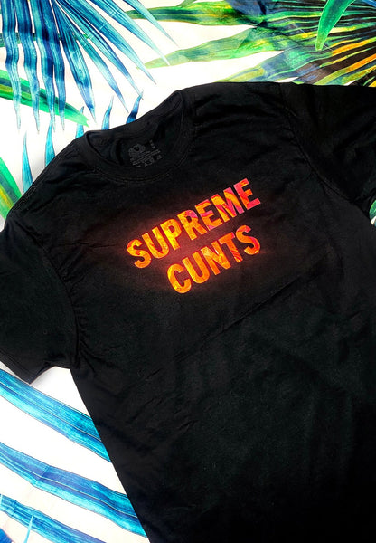 black graphic t shirt on a palm background close up