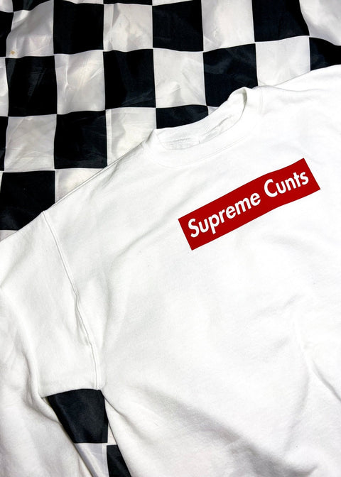 white sweatshirt on black and white checkerboard background close up