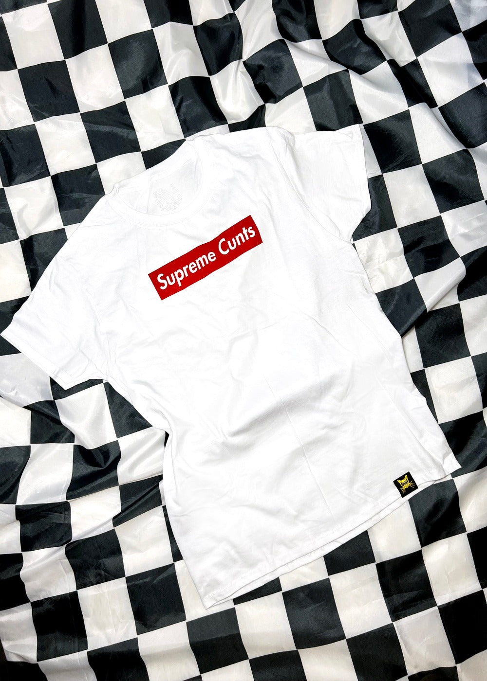 white t shirt on a black and white checkerboard background