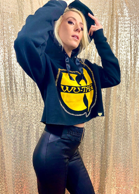 black hoodie with yellow wu-tang logo sewn on front on model side view